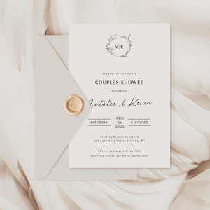 May include: A white wedding invitation with a gold wax seal. The invitation is for a couples shower honoring Natalie & Kevin. The shower will be held on Saturday, August 26, 2024 at 4 o'clock at Starling Estates Vineyard, 363 Lakeshore Drive, Kelowna, BC. RSVP to Jenna at 123-456-7890. Registered at Crate and Barrel and West Elm.