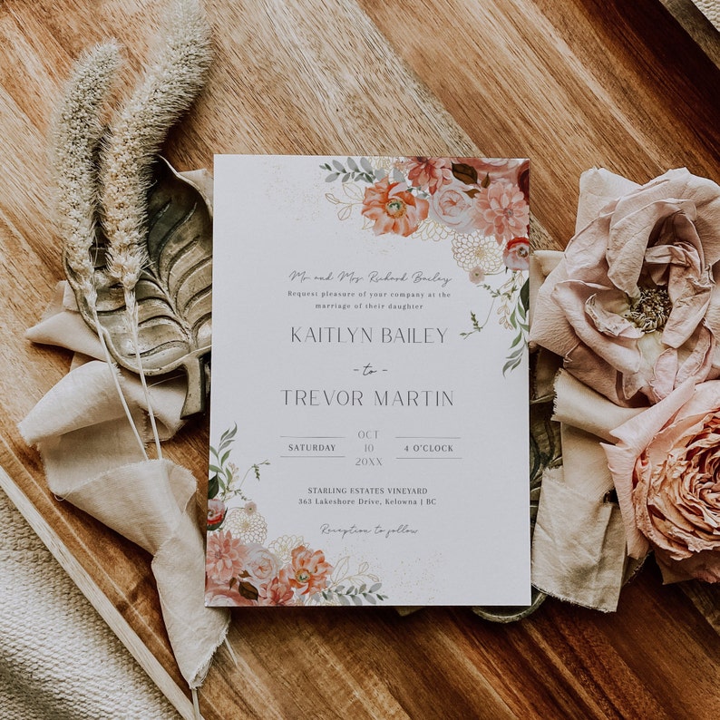 May include: A wedding invitation featuring a floral design in shades of pink, white, and green. The invitation is for the wedding of Kaitlyn Bailey and Trevor Martin on 10th October 20XX at 4 o'clock at Starling Estates Vineyard in Kelowna, BC.