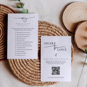 May include: Two white cards with black text. The first card has a checklist titled "I Spy Wedding Photo Challenge" with a list of wedding photo ideas. The second card says "Share the Love" and has a QR code with the text "Share your photos with us: Simply scan the QR code with your smartphone and upload your photos. See the back for photo ideas! #AVERYLOVESJACOB".