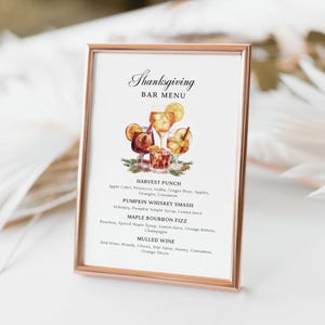 May include: A printable Thanksgiving bar menu sign with a watercolor illustration of cocktails. The menu lists drinks like Harvest Punch, Pumpkin Whiskey Smash, Maple Bourbon Fizz, and Mulled Wine.