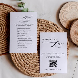 May include: A white card with a wedding photo challenge checklist. The checklist includes items like "a group shot of your table", "the cake before it's been cut", and "something blue". The card also has a QR code and the text "Capture the Love" and "#SabrinaLovesMarco".