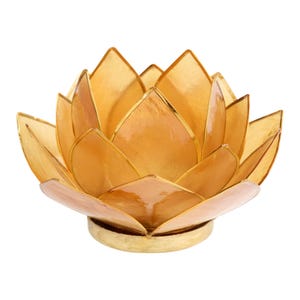 May include: A golden lotus flower sculpture with layered petals and a gold-colored base. The petals have a translucent quality, and the edges are outlined in gold. The sculpture is designed to resemble a lotus flower.