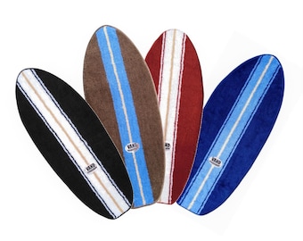 Surfboard shaped rug bath mat