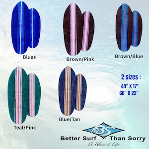May include: Five sets of two oval-shaped mats in various colour combinations: blue, brown and pink, brown and blue, teal and pink, and blue and tan. Each mat features a central vertical stripe. Text indicates 2 sizes: 44" x 17" and 60" x 22".