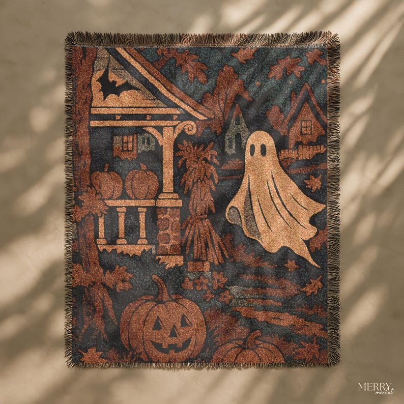 May include: A Halloween-themed throw blanket featuring a dark blue backdrop with pumpkins, a ghost, and a house design. The blanket has a fringed edge and is made of a soft material. The color scheme includes orange, brown, and black hues.
