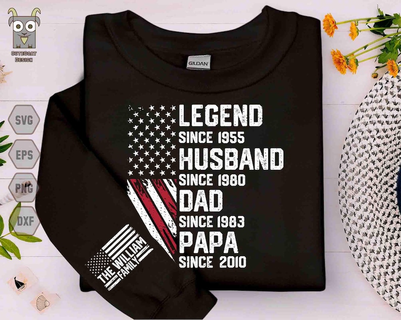Puede incluir: Sudadera negra con un dise&ntilde;o de bandera estadounidense y el texto "LEGEND SINCE 1955, HUSBAND SINCE 1980, DAD SINCE 1983, PAPA SINCE 2010." La manga muestra "THE WILLIAM FAMILY" y una peque&ntilde;a bandera.