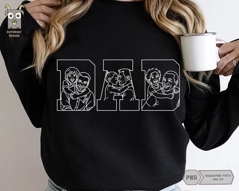 May include: Black sweatshirt with the word "DAD" in white block letters. Each letter features a line drawing of a father with his child. The sweatshirt is a crew neck style and has long sleeves. A white mug is held in the hand.