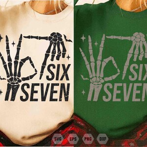 May include: Two sweatshirts, one cream-colored and one green, each featuring a skeleton hand graphic. The hands are making the 'okay' sign and the text reads 'SIX SEVEN'. The design includes star accents.