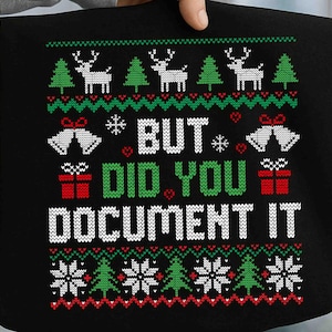 May include: Black tote bag with a festive Christmas sweater design. The design includes reindeer, Christmas trees, snowflakes, bells, and gift boxes. The text "BUT DID YOU DOCUMENT IT" is prominently displayed in white and green.
