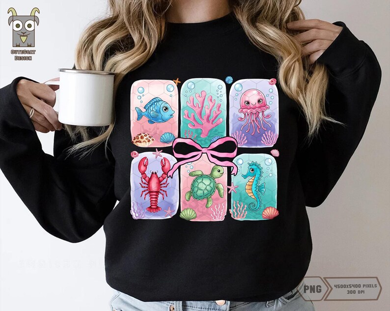 May include: Black sweatshirt with a colorful graphic of a gift box filled with sea creatures. The box is tied with a pink ribbon and contains a seahorse, a turtle, a lobster, a jellyfish, and a fish.