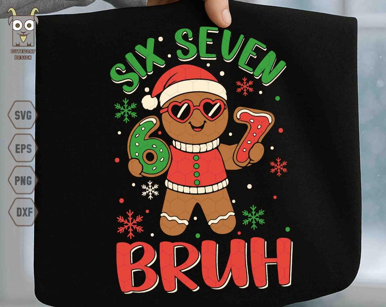 May include: Black graphic tee featuring a gingerbread man wearing heart-shaped sunglasses and a Santa hat. The text reads "SIX SEVEN BRUH" in green and red, with snowflake accents. The gingerbread man is holding a number 6 and a number 7.