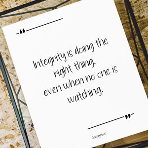 May include: A white background with black text that reads "Integrity is doing the right thing, even when no one is watching." The text is in a handwritten font and is attributed to "Anonymous".