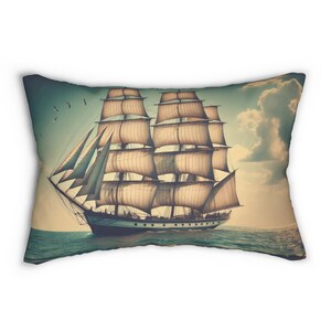 May include: A vintage-style pillow featuring a large, detailed illustration of a sailing ship with billowing sails against a blue sky with white clouds.