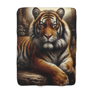 May include: A close-up of a tiger lying down in a forest setting. The tiger has orange and black stripes and is looking directly at the viewer. The tiger's fur is soft and fluffy, and its eyes are bright and alert.