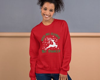 May include: Red Christmas sweatshirt with a white reindeer and green text that reads "Hold Me Closer Tiny Prancer".