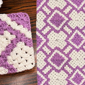 May include: A square, handmade crochet item with a repeating pattern of white and lavender diamonds. The item is made with a granny stitch and has a lavender border. The item is likely a coaster or a small blanket.