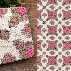 May include: A square, handmade crochet item with a geometric pattern. The design features a central starburst in white and brown, surrounded by a border of pink squares. The pattern is repeated in a larger design.