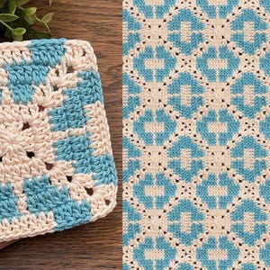 May include: Handmade crochet coaster in a square shape. The coaster features a repeating pattern of light blue and cream-colored squares. The coaster is held in a hand, with a matching pattern visible in the background.