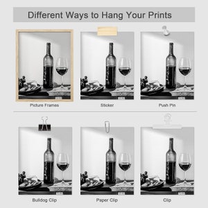 May include: A black and white photo of a bottle of wine and a glass of wine on a table. The photo is displayed in six different ways, including a picture frame, sticker, push pin, bulldog clip, paper clip, and clip.