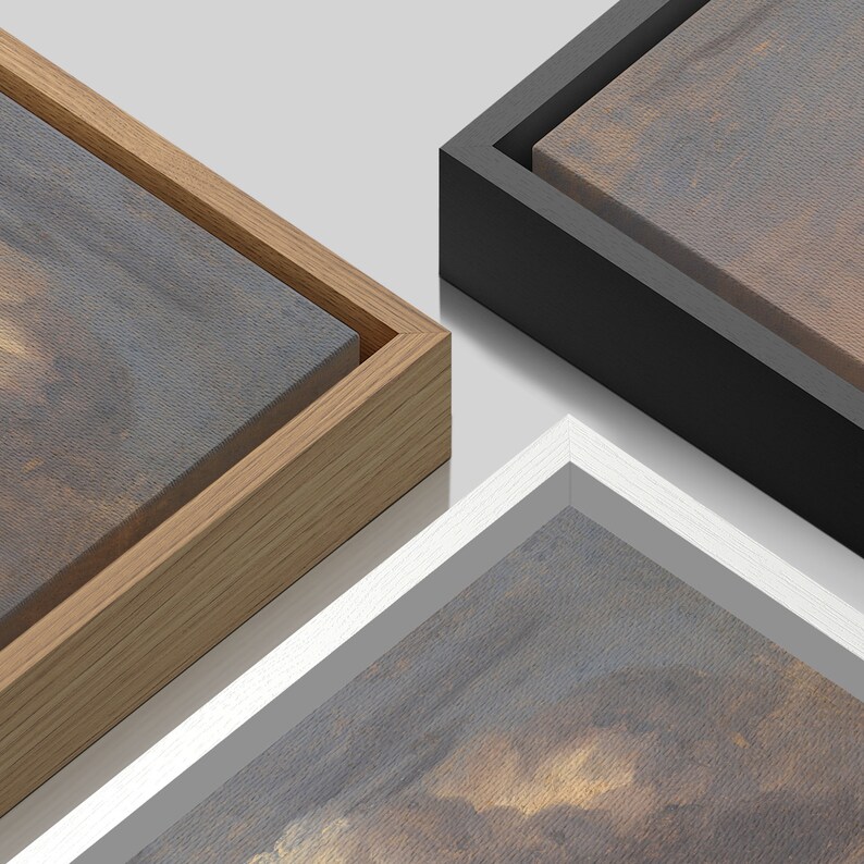 May include: Three different wood frames, each with a canvas print inside. The frames are in natural wood, black, and white.