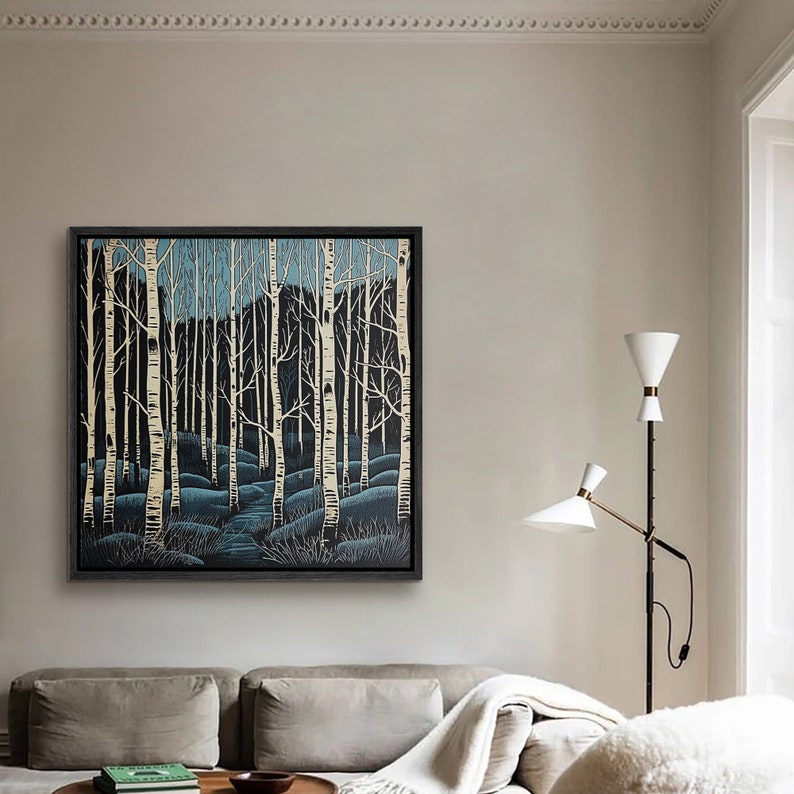 May include: A framed print of a forest scene with white birch trees against a dark blue background. The trees are stylized and the scene is reminiscent of a winter landscape.
