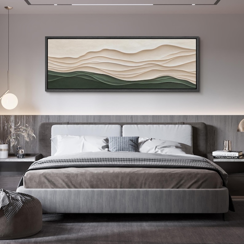 May include: A modern bedroom with a gray headboard and a bed with a brown and white patterned blanket. A large abstract painting with beige and green colors hangs above the bed.