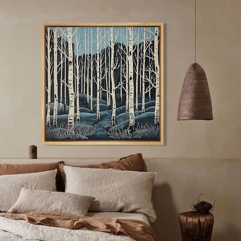 May include: A framed print of a forest scene with white birch trees and a blue sky. The trees are silhouetted against the sky, and the ground is covered in blue and green brush.