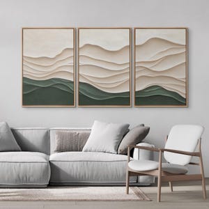 May include: A set of three abstract landscape paintings with a layered, textured effect. The paintings feature a combination of beige and green hues, creating a calming and modern aesthetic.