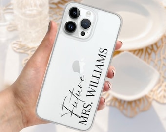 May include: A white phone case with a clear back and black text that says "Future Mrs. Williams".