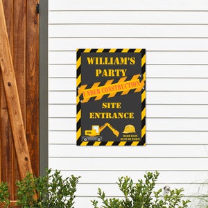 May include: A black and yellow construction themed party sign with the text "William's Party Under Construction Site Entrance Hard Hats Must Be Worn!"