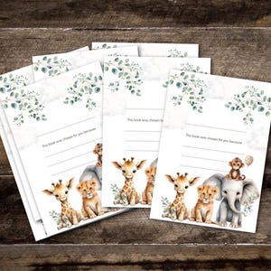May include: A collection of baby shower cards featuring watercolour illustrations of safari animals, such as giraffes, lions, elephants, and monkeys. Each card has the text "This book was chosen for you because" and a space for writing.