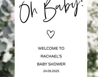 May include: White sign with black calligraphy that reads "Oh Baby!" with a small heart below. The sign also includes the text "Welcome to Rachael's Baby Shower 24.09.2025".