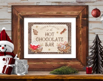 May include: A rustic wooden frame with a white mat and a printed sign that reads "Come & Warm Up at the Hot Chocolate Bar". The sign features illustrations of gingerbread cookies, cinnamon sticks, and a mug of hot chocolate with whipped cream.