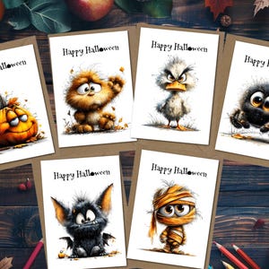 May include: Six rectangular greeting cards with white backgrounds, each featuring the text Happy Halloween and a cartoon illustration of a pumpkin, a furry creature, a duck, a spider, a bat, or a mummy, all set on a dark wooden surface.