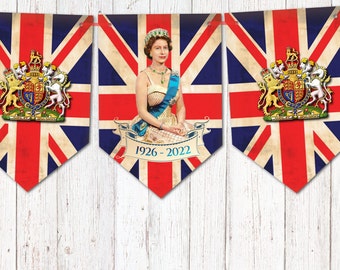 May include: A red, white and blue bunting with a portrait of Queen Elizabeth II and the years 1926-2022. The bunting features the royal coat of arms.