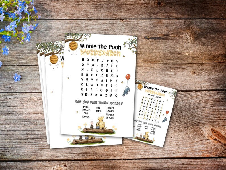 May include: A stack of Winnie the Pooh word search activity sheets. The sheets feature a word search grid, illustrations of Pooh and friends, and the text "Winnie the Pooh WORDSEARCH". An answer sheet is also included.