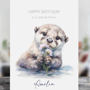 Jolie carte de voeux d'anniversaire personnalisée loutre et marguerites - choisissez la taille et le destinataire
