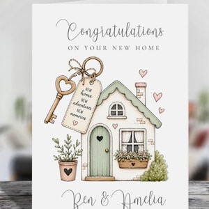 May include: A white greeting card featuring the text Congratulations ON YOUR NEW HOME and Ben & Amelia. The illustration shows a house with a green door, a key with a tag reading NEW home NEW adventures NEW memories, and a potted plant.