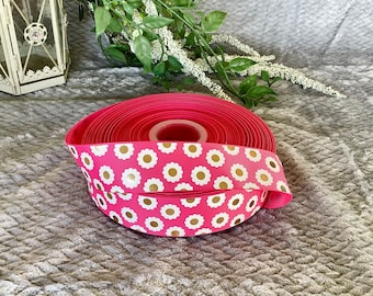 Pink holographic daisy 1.5 inch grosgrain ribbon.