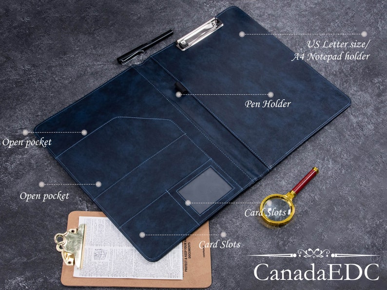 May include: A dark blue leather-like portfolio folder featuring a metal clipboard clip, a pen holder, two open pockets, and card slots. The interior is labeled with text indicating it is a US Letter size and A4 notepad holder.