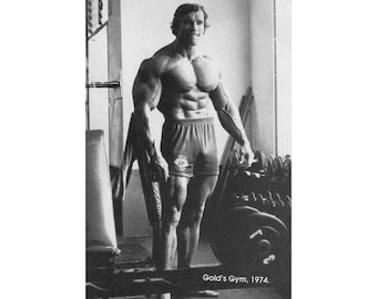 May include: Monochrome poster depicting a bodybuilder in a gym. The image shows a muscular person in shorts, posing near weights. The text at the bottom reads "Gold's Gym, 1974."