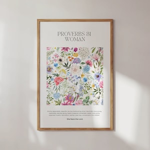 May include: A framed print featuring a floral design and the text "Proverbs 31 Woman" and a verse from the Bible. The flowers are in shades of pink, purple, blue, yellow, and green.
