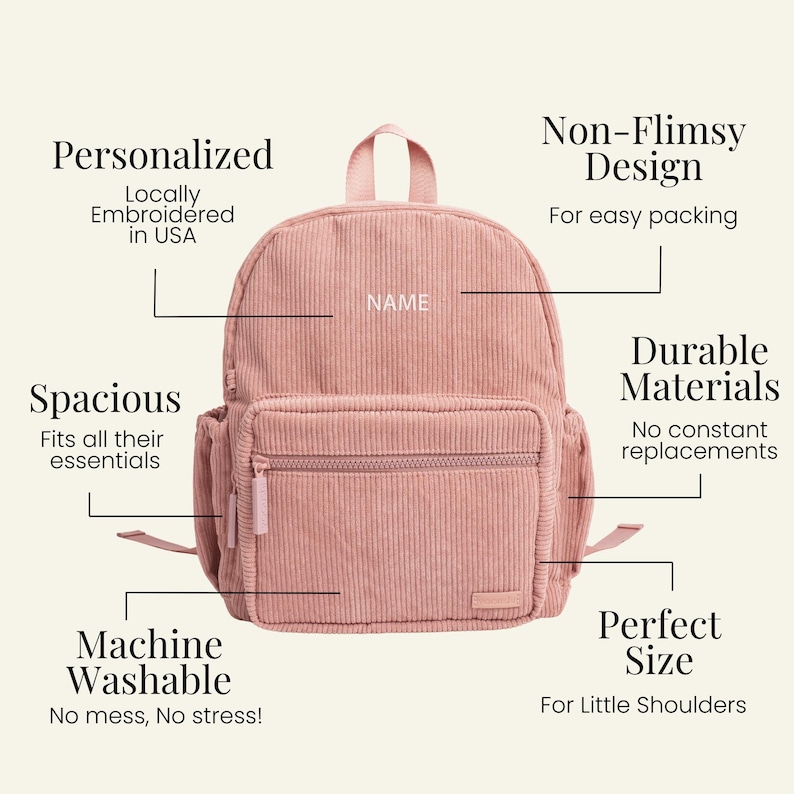 May include: A pink corduroy backpack with a zippered pocket and a name tag that says "NAME". The backpack is machine washable and has a spacious design.