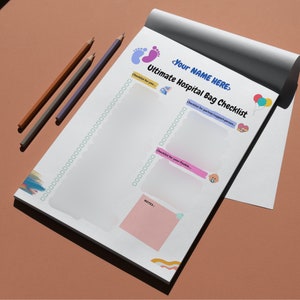 May include: A white checklist with a black border and the text "Ultimate Hospital Bag Checklist" with a blue footprint, a pink baby bottle, a pink heart, and a blue pacifier. The checklist is divided into three sections: "Checklist for you", "Checklist for partner/support person", and "Checklist for your Pokie".