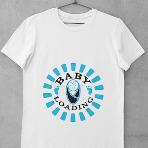 May include: White t-shirt with a blue and black graphic of a baby in a swaddle with the text "BABY LOADING" around it.
