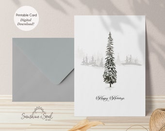 May include: A printable holiday card featuring a black and white watercolor illustration of a snowy pine tree in a forest. The text "Happy Holidays" is written in cursive at the bottom of the card.