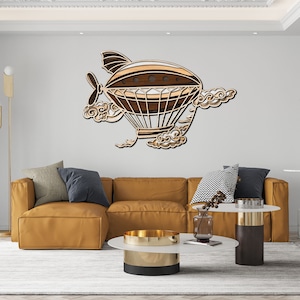 May include: A wooden airship wall art piece. The airship is brown, tan, and white, with a propeller and cloud details. The artwork is mounted on a white wall above a mustard-colored sectional sofa. The room has a modern design.