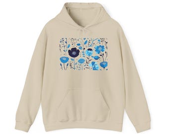 May include: A beige hoodie with a blue and black floral print. The print features a variety of flowers and leaves in a stylized design.