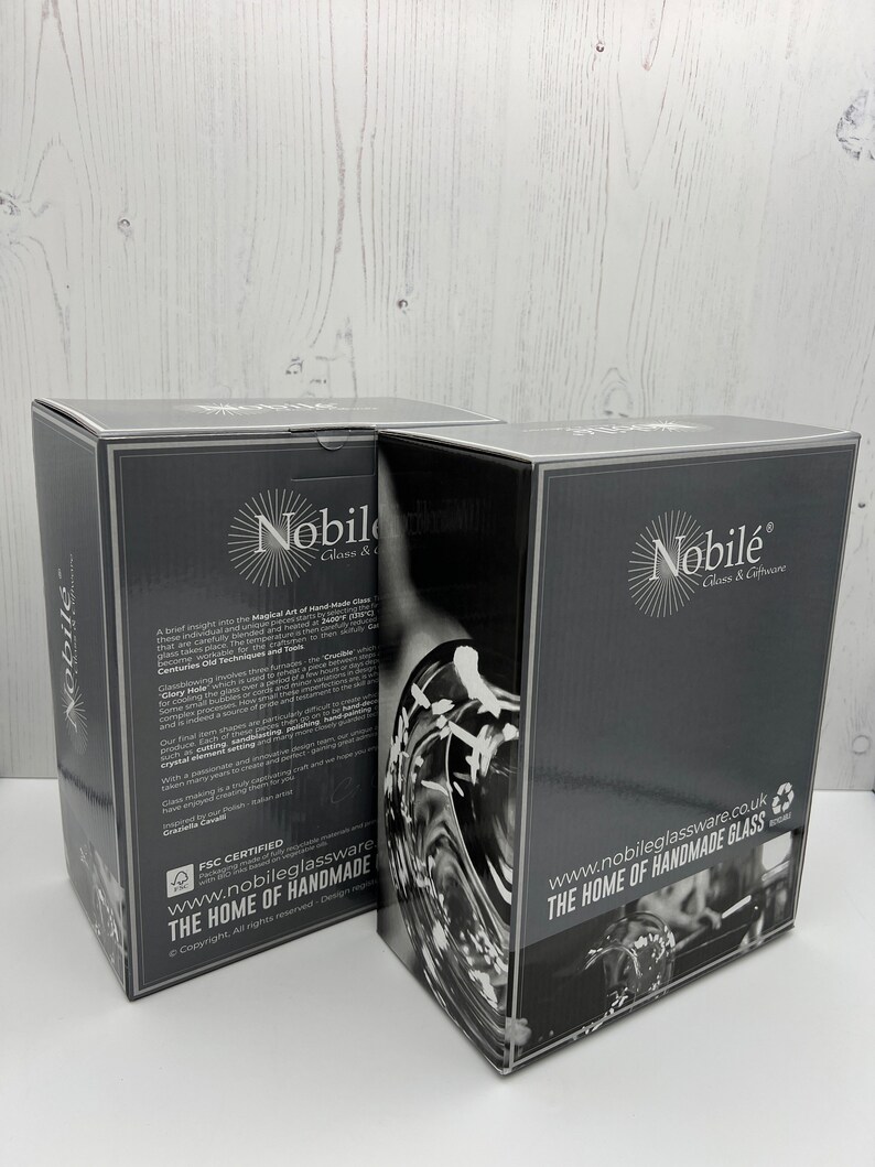 May include: Two black boxes with the logo "Nobil&eacute; Glass & Giftware" and the text "www.nobileglassware.co.uk THE HOME OF HANDMADE GLASS". The boxes are stacked on top of each other.