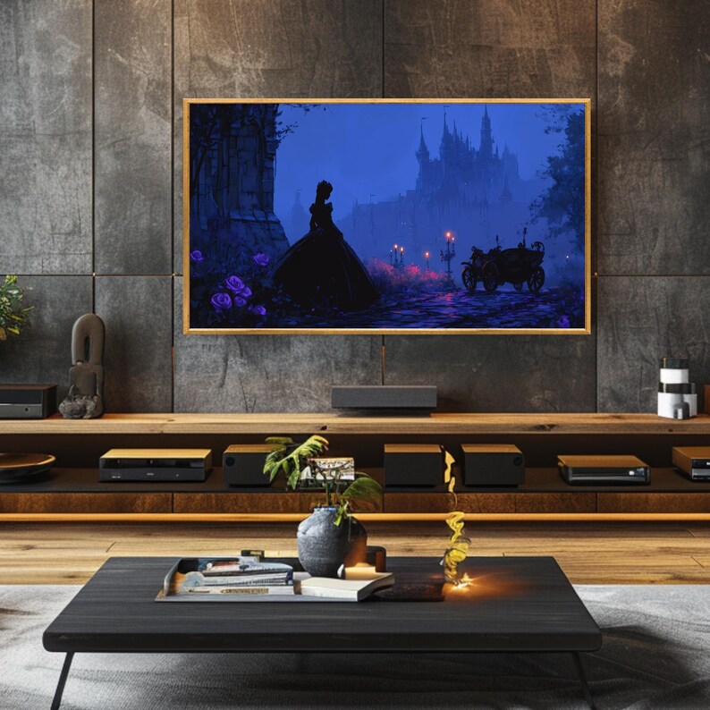 May include: A framed digital art print depicting a silhouette of a person in a long gown, standing before a castle. The artwork is set against a dark blue backdrop with purple accents, and a carriage is visible in the distance. The frame is a light wood color.